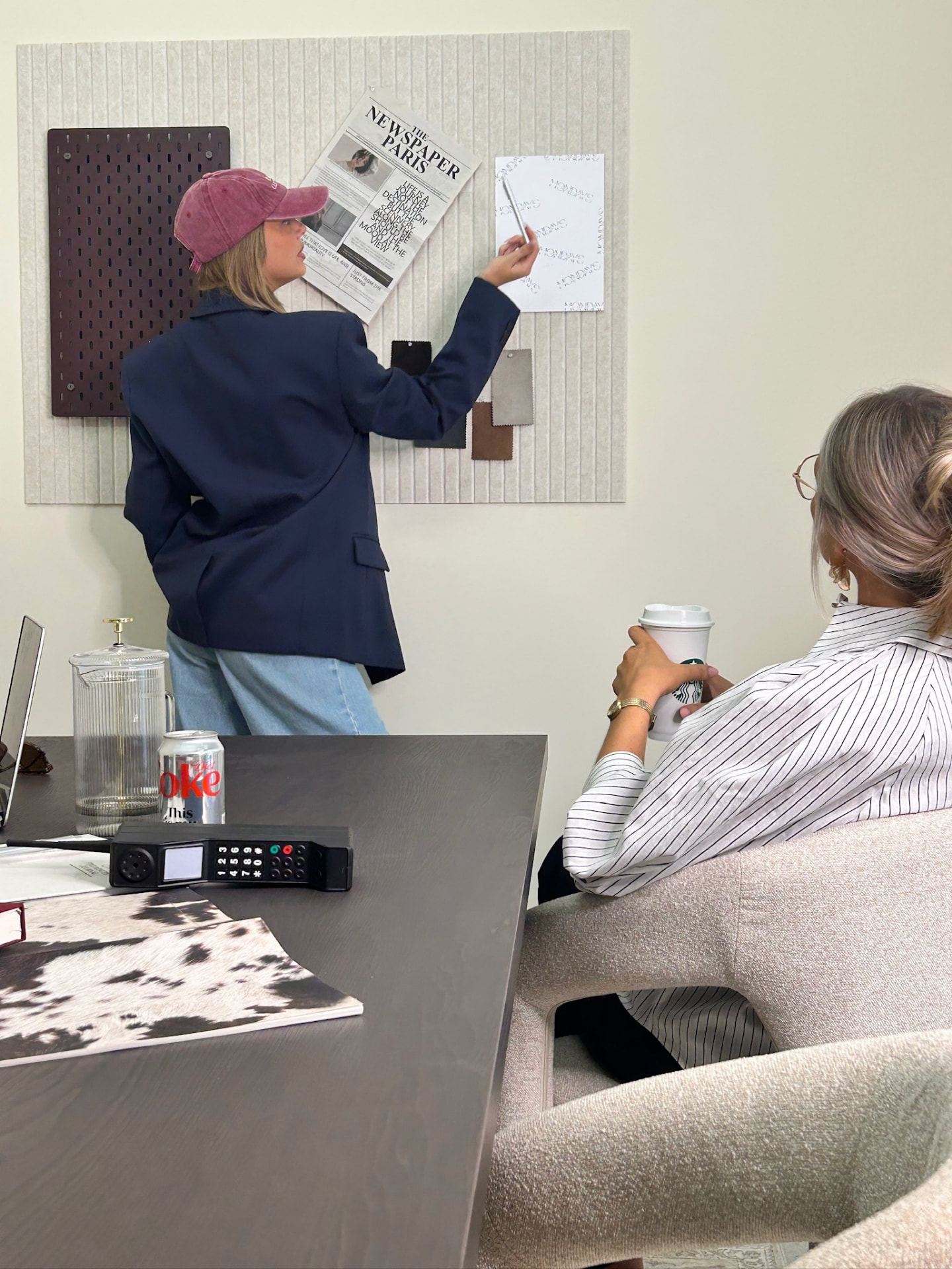 Planning a shoot against the moodboard wall at Mondays Content Co