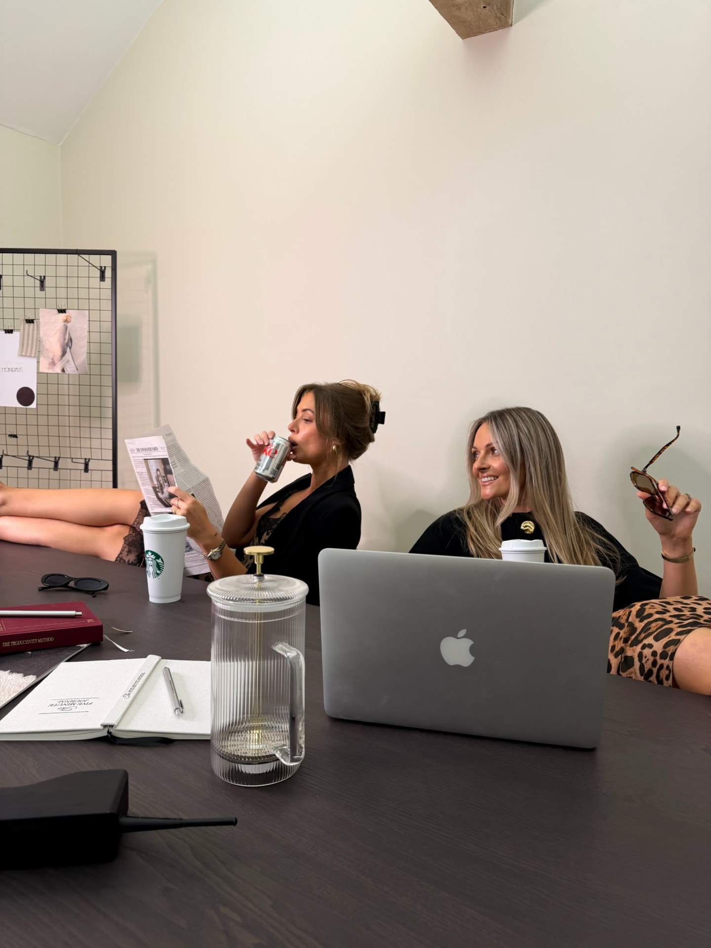 Working at the boardroom table with coffee