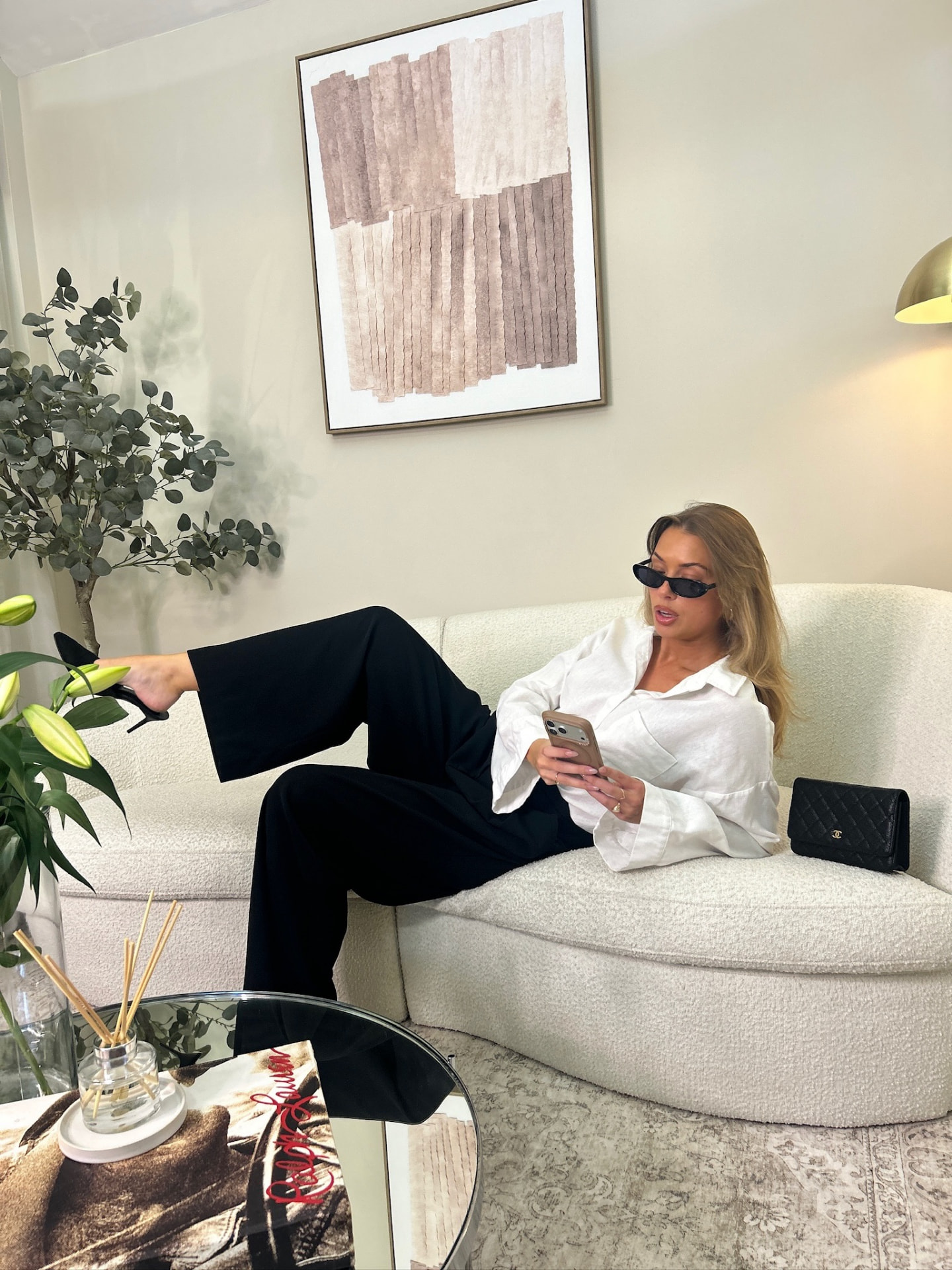 Lounging on the boucle sofa in the living area set